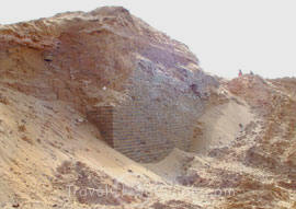 "A fortress tower covered by sands"